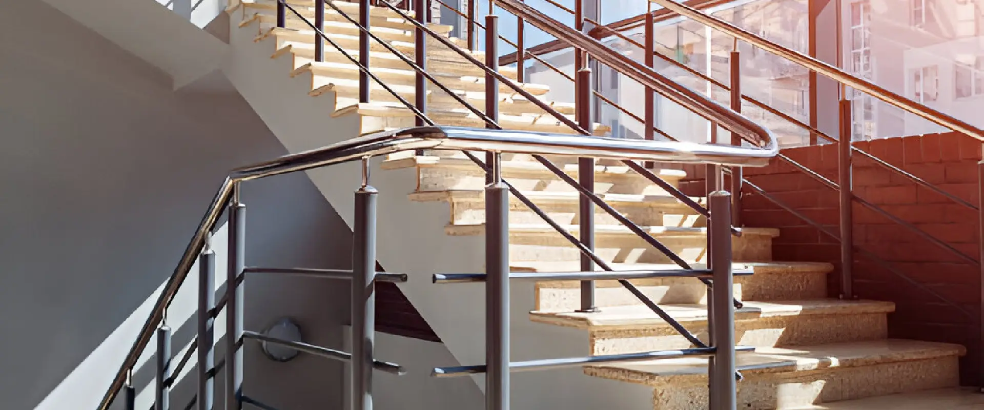 SS + Glass Staircase Railing (SS304 Brushed Finish + Toughened Glass) — Multi-level atrium staircase assembly — Sun Railings commercial project delivery